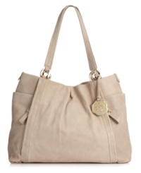 A season-spanning style that epitomizes effortless chic. This Vince Camuto tote features a spacious interior, polished gold-tone hardware and easy-access exterior side pockets. A season-spanning style that epitomizes effortless chic. This Vince Camuto tote features a spacious interior, polished gold-tone hardware and easy-access exterior side pockets.