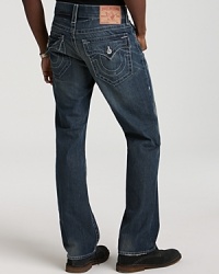 White stitching contrasts with a dark wash on these straight leg True Religion jeans, complete with signature triangle and horseshoe back pockets. White stitching contrasts with a dark wash on these straight leg True Religion jeans, complete with signature triangle and horseshoe back pockets.