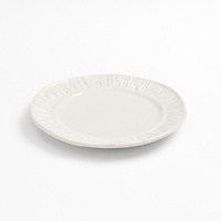 Michael Wainwright has returned to his sculptural roots with his Origin collection, a pure porcelain rendering of his most popular textured patterns. The Giotto design evokes the naturalistic quality of early Italian Renaissance paintings. These functional works of art are dishwasher and microwave safe, can go from freezer-to-oven, and can be used for baking or broiling. Michael Wainwright has returned to his sculptural roots with his Origin collection, a pure porcelain rendering of his most popular textured patterns. The Giotto design evokes the naturalistic quality of early Italian Renaissance paintings. These functional works of art are dishwasher and microwave safe, can go from freezer-to-oven, and can be used for baking or broiling.