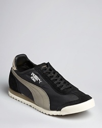 A comfortable, sporty sneaker from PUMA reestablishes your ground for a casual cool look with designer jeans and a hoodie. A comfortable, sporty sneaker from PUMA reestablishes your ground for a casual cool look with designer jeans and a hoodie.