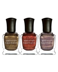 Rock This Town Glitz and Glimmer Holiday Nail Lacquer Trio, Limited EditionMoon Dance (deep lavender swirl, glimmer)Chain Reaction (dirty brass, glimmer)Phoenix Rising (foxy copper, glimmer)Get ready to celebrate this holiday season with the Rock this Town holiday nail lacquer trio by Deborah Lippmann. The set includes three stunning shades with a sophisticated shimmer that will turn heads as you make your way through the holiday party circuit.There's a hue to suit every occasion and complement any outfit throughout the season. Choose from Moon Dance, Chain Reaction and Phoenix Rising to add glamorous glitz to your holiday look. Whether spending time with family and friends or party-hopping, your nails will rock this town in these fashion-forward shades. Rock This Town Glitz and Glimmer Holiday Nail Lacquer Trio, Limited EditionMoon Dance (deep lavender swirl, glimmer)Chain Reaction (dirty brass, glimmer)Phoenix Rising (foxy copper, glimmer)Get ready to celebrate this holiday season with the Rock this Town holiday nail lacquer trio by Deborah Lippmann. The set includes three stunning shades with a sophisticated shimmer that will turn heads as you make your way through the holiday party circuit.There's a hue to suit every occasion and complement any outfit throughout the season. Choose from Moon Dance, Chain Reaction and Phoenix Rising to add glamorous glitz to your holiday look. Whether spending time with family and friends or party-hopping, your nails will rock this town in these fashion-forward shades.