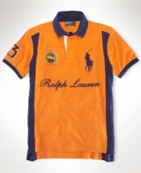 A custom-fitting rugby shirt celebrating the St. Moritz Polo World Cup on Snow receives a preppy feel with a scripted Ralph Lauren logo, bold color-blocking and Ralph Lauren's embroidered Big Pony. A custom-fitting rugby shirt celebrating the St. Moritz Polo World Cup on Snow receives a preppy feel with a scripted Ralph Lauren logo, bold color-blocking and Ralph Lauren's embroidered Big Pony.