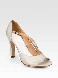 Tried-and-true leather peep toe with an elegant, asymmetrical buckle strap. Self-covered heel, 4 (100mm)Leather upperLeather lining and solePadded insoleMade in ItalyOUR FIT MODEL RECOMMENDS ordering one half size up as this style runs small. Tried-and-true leather peep toe with an elegant, asymmetrical buckle strap. Self-covered heel, 4 (100mm)Leather upperLeather lining and solePadded insoleMade in ItalyOUR FIT MODEL RECOMMENDS ordering one half size up as this style runs small.