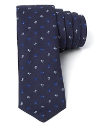 A modern, skinny width tie from Paul Smith keeps its eye on the classics with a vintage-inspired floral print. A modern, skinny width tie from Paul Smith keeps its eye on the classics with a vintage-inspired floral print.
