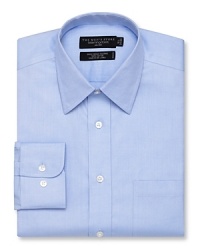Long sleeve dress shirt with spread collar. Single needle tailoring, angle cut barrel cuffs with two buttons to resize width. Pocket at left chest. Textured solid blue. Long sleeve dress shirt with spread collar. Single needle tailoring, angle cut barrel cuffs with two buttons to resize width. Pocket at left chest. Textured solid blue.