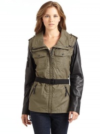 THE LOOKTailored from water repellent coated Egyptian cotton twillStand collar with drawstringsShoulder tabsConcealed front zipperLong-sleeve jacket converts to a vest with zip-off leather sleevesZip pocket at one sleeveDual snap flap pocketsDual front zip pocketsRemovable elastic belt with logo buckleInterior drawstrings cinch the waistTHE FITAbout 26 from shoulder to hemTHE MATERIALShell: cotton and polyurethaneSleeves: THE LOOKTailored from water repellent coated Egyptian cotton twillStand collar with drawstringsShoulder tabsConcealed front zipperLong-sleeve jacket converts to a vest with zip-off leather sleevesZip pocket at one sleeveDual snap flap pocketsDual front zip pocketsRemovable elastic belt with logo buckleInterior drawstrings cinch the waistTHE FITAbout 26 from shoulder to hemTHE MATERIALShell: cotton and polyurethaneSleeves: