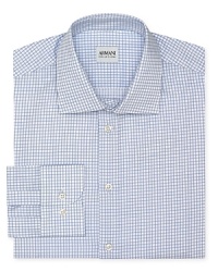 This refreshing take on a classic windowpane check shirt offers a contemporary fit in superior Italian cotton for a truly refined masterpiece from Armani Collezioni. This refreshing take on a classic windowpane check shirt offers a contemporary fit in superior Italian cotton for a truly refined masterpiece from Armani Collezioni.