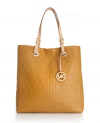 A classic monogram exterior gives this MICHAEL Michael Kors tote a look that will remain classic for seasons to come. This chic design is accented with signature 18K gold hardware and buckle detailed handles. A classic monogram exterior gives this MICHAEL Michael Kors tote a look that will remain classic for seasons to come. This chic design is accented with signature 18K gold hardware and buckle detailed handles.