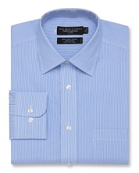 Long sleeve dress shirt with spread collar. Single needle tailoring, angle cut barrel cuffs with two buttons to resize width. Pocket at left chest. Subtle stripe pattern throughout.