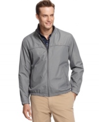 Don't let a little rain keep you away from the links. Stay dry and comfortable in this wind resistant, water repellent golf jacket from Greg Norman for Tasso Elba. Don't let a little rain keep you away from the links. Stay dry and comfortable in this wind resistant, water repellent golf jacket from Greg Norman for Tasso Elba.