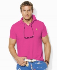 A classic-fitting short-sleeved polo shirt in breathable cotton mesh exudes iconic style with Ralph Lauren's signature embroidery. A classic-fitting short-sleeved polo shirt in breathable cotton mesh exudes iconic style with Ralph Lauren's signature embroidery.