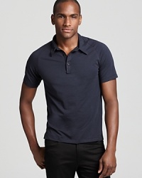 With subtle 1970s styling and a body-hugging slim fit a jersey polo shirt from Theory gets a dose of retro-centric sophistication. With subtle 1970s styling and a body-hugging slim fit a jersey polo shirt from Theory gets a dose of retro-centric sophistication.