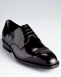 Brogue detail, usually reserved for wingtips, adorns the cap toe of these handsome dress shoes for a unique addition to your distinguished wardrobe. Brogue detail, usually reserved for wingtips, adorns the cap toe of these handsome dress shoes for a unique addition to your distinguished wardrobe.
