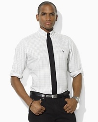 Tailored in a modern trim-fitting silhouette, a windowpane-checked sport shirt is rendered in washed oxford-woven cotton for the look and feel of a well-worn wardrobe favorite. Tailored in a modern trim-fitting silhouette, a windowpane-checked sport shirt is rendered in washed oxford-woven cotton for the look and feel of a well-worn wardrobe favorite.