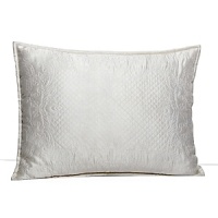 This luxurious all-white bedding ensemble incorporates couture-inspired details - from intricate floral embroidery to elegant silk matelasse - for a feminine vision of modern romance. This luxurious all-white bedding ensemble incorporates couture-inspired details - from intricate floral embroidery to elegant silk matelasse - for a feminine vision of modern romance.
