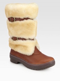 Belt-inspired straps cinch this plush shearling boot with rich leather accents. Shaft, 10¼Leg circumference, 14Shearling and leather upperPull-on style with adjustable leather strapsShearling liningRubber trek solePadded insoleImported Belt-inspired straps cinch this plush shearling boot with rich leather accents. Shaft, 10¼Leg circumference, 14Shearling and leather upperPull-on style with adjustable leather strapsShearling liningRubber trek solePadded insoleImported