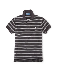 Tailored in a relaxed, comfortable fit that's cut wider through the body, this short-sleeved polo shirt is rendered in breathable cotton mesh with sleek stripes for casual polish Tailored in a relaxed, comfortable fit that's cut wider through the body, this short-sleeved polo shirt is rendered in breathable cotton mesh with sleek stripes for casual polish