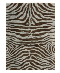 Exotic designs will be the pride of your decor. Adorned with zebra stripes in aqua blue and brown, this Nourison rug has a marvelously soft and shaggy pile that's hand-tufted from premium-quality yarns. Beautiful in appearance and plush underfoot, this area rug creates an atmosphere of casual elegance. (Clearance) Exotic designs will be the pride of your decor. Adorned with zebra stripes in aqua blue and brown, this Nourison rug has a marvelously soft and shaggy pile that's hand-tufted from premium-quality yarns. Beautiful in appearance and plush underfoot, this area rug creates an atmosphere of casual elegance. (Clearance)
