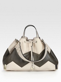 Two-tone leather carryall featuring a playful zigzag pattern and versatile shoulder strap. Double top handles, 6 dropDetachable shoulder strap, 21 dropLeather drawstring closureProtective metal feetDetachable inner zip pouchFully lined18W X 11H X 7DMade in Italy Two-tone leather carryall featuring a playful zigzag pattern and versatile shoulder strap. Double top handles, 6 dropDetachable shoulder strap, 21 dropLeather drawstring closureProtective metal feetDetachable inner zip pouchFully lined18W X 11H X 7DMade in Italy