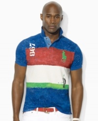 Light paint splatters and surplus-inspired graphics lend a rugged quality to a color-blocked polo shirt, crafted for a relaxed fit from breathable cotton mesh. Light paint splatters and surplus-inspired graphics lend a rugged quality to a color-blocked polo shirt, crafted for a relaxed fit from breathable cotton mesh.