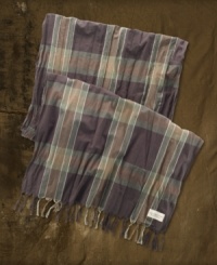 A lightweight, fringed scarf in plaid woven cotton gives a rugged finishing touch to any look. A lightweight, fringed scarf in plaid woven cotton gives a rugged finishing touch to any look.