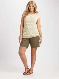 Cable-knit chic, slip into this stretch cotton top, which features a wavy pattern for an unforgettable look.V-necklineCap sleevesRibbed trimPull-on styleAbout 28 from shoulder to hem66% cotton/34% polyamideHand washImported of Italian fabric