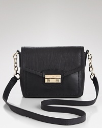 City sleek design comes calling on this leather Cole Haan crossbody, which features a slim silhouette, trimmed by two, easy-access exterior pockets. City sleek design comes calling on this leather Cole Haan crossbody, which features a slim silhouette, trimmed by two, easy-access exterior pockets.