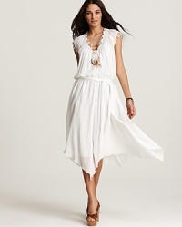 This pale Rebecca Taylor dress is defined by its fluid silhouette, golden feather necklace and asymmetric hem, redefining boho chic with stunning detail. This pale Rebecca Taylor dress is defined by its fluid silhouette, golden feather necklace and asymmetric hem, redefining boho chic with stunning detail.