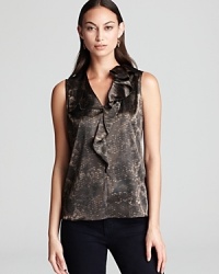 Enlivened by sleek snakeskin print and a decadently ruffled collar, this T Tahari blouse gives your everyday style a wild sense of adventure. Enlivened by sleek snakeskin print and a decadently ruffled collar, this T Tahari blouse gives your everyday style a wild sense of adventure.