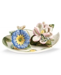 A pink magnolia and morning glory blossom into Botanic Hummingbird salt and pepper shakers for the nature lover's table. With a heart-shaped tray. From Portmeirion's serveware collection. A pink magnolia and morning glory blossom into Botanic Hummingbird salt and pepper shakers for the nature lover's table. With a heart-shaped tray. From Portmeirion's serveware collection.