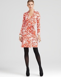 A classic DIANE von FURSTENBERG wrap dress belongs in every woman's closet--this vibrantly-printed DVF statement maker lends a body-hugging fit, designed to flatter from every angle, in a silk jersey knit.