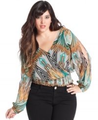 Leave them wanting more with Baby Phat's printed plus size top, featuring an open back. Leave them wanting more with Baby Phat's printed plus size top, featuring an open back.