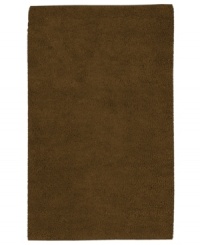 Step into ultimate softness with this opulent area rug, hand-woven with sumptuous New Zealand felted wool. In warm brown tone, this lush piece fits both traditional and contemporary decor. Step into ultimate softness with this opulent area rug, hand-woven with sumptuous New Zealand felted wool. In warm brown tone, this lush piece fits both traditional and contemporary decor.