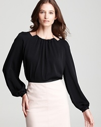 Take the work out of getting ready with this BOSS Black blouse, outfitted with sleek metallic embellishment for a chic necklace effect. Take the work out of getting ready with this BOSS Black blouse, outfitted with sleek metallic embellishment for a chic necklace effect.