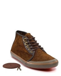 The Krona rocks a low, skater-style profile in soft suede with reverse-leather trim along the collar, eyelets and sides. The Krona rocks a low, skater-style profile in soft suede with reverse-leather trim along the collar, eyelets and sides.