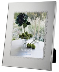 A delicate lace-inspired pattern trims sleek silver plate, giving Vera Wang's Flirt picture frame a sense of timeless grace and femininity. A delicate lace-inspired pattern trims sleek silver plate, giving Vera Wang's Flirt picture frame a sense of timeless grace and femininity.