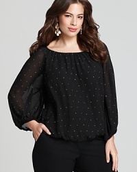Gold-tone rhinestones punctuate the clean silhouette of this VINCE CAMUTO Plus blouse for a polished office essential with touch of punk. Gold-tone rhinestones punctuate the clean silhouette of this VINCE CAMUTO Plus blouse for a polished office essential with touch of punk.
