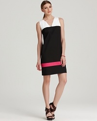 A refined take on color blocking, this DKNY sheath pairs bold tones with a vivid pink stripe for a tough take on femininity. A refined take on color blocking, this DKNY sheath pairs bold tones with a vivid pink stripe for a tough take on femininity.