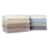 The velour front and absorbent terry cloth back makes this Hudson Park bath towel both beautiful and functional.