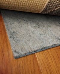 Stop your rug from slipping! No matter where you want to place your area rug, this reversible rug pad easily flips for use on either hard or soft surfaces with its dual-sided construction. Its thickness also works on uneven surfaces, like tile or concrete, to keep your rug even and firmly held in its place. Stop your rug from slipping! No matter where you want to place your area rug, this reversible rug pad easily flips for use on either hard or soft surfaces with its dual-sided construction. Its thickness also works on uneven surfaces, like tile or concrete, to keep your rug even and firmly held in its place.
