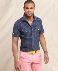 From the backyard to the nightclub, this short-sleeved plaid shirt from Tommy Hilfiger is a go-anywhere addition to your seasonal style. From the backyard to the nightclub, this short-sleeved plaid shirt from Tommy Hilfiger is a go-anywhere addition to your seasonal style.