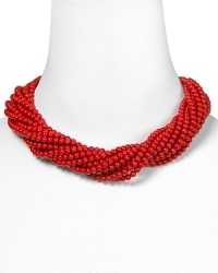 Nod to natural influences with this multi-strand coral bib necklace from Carolee. Its bold and beaded look instantly enlivens every neckline. Nod to natural influences with this multi-strand coral bib necklace from Carolee. Its bold and beaded look instantly enlivens every neckline.