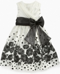 She can make any occasion extra special in this floral dress from Bonnie Jean, with beautiful flower silhouettes adding a striking style accent. She can make any occasion extra special in this floral dress from Bonnie Jean, with beautiful flower silhouettes adding a striking style accent.