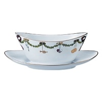With its elegant depictions of pine garlands, red ribbons and traditional Christmas ornaments, Royal Copenhagen's fine bone-china serveware is the perfect backdrop to a joyous holiday celebration. A well-loved classic, the Star Fluted design was first produced in 1895.