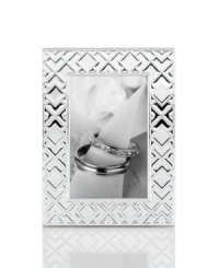 Mirroring the intricate folds of origami, this gleaming silver-plated picture frame makes art of any memory. From Martha Stewart Collection. Mirroring the intricate folds of origami, this gleaming silver-plated picture frame makes art of any memory. From Martha Stewart Collection.