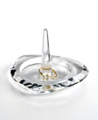 Show some love. This precious crystal ring holder from Oleg Cassini is meticulously handcrafted in a heart shape that dazzles with faceted cuts. Hallmarked with designer's signature. Show some love. This precious crystal ring holder from Oleg Cassini is meticulously handcrafted in a heart shape that dazzles with faceted cuts. Hallmarked with designer's signature.