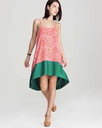 An Aqua color block dress is the uptown chic silhouette of the season, marrying a printed panel and a solid hem for a curated city look when paired with nude spectator-inspired pumps and a sleek matching clutch. An Aqua color block dress is the uptown chic silhouette of the season, marrying a printed panel and a solid hem for a curated city look when paired with nude spectator-inspired pumps and a sleek matching clutch.
