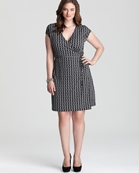 The classic MICHAEL Michael Kors Plus wrap dress gets a new season spin with an edgy chain-link print for a for a polished 9-to-5 style with a hint of punk attitude. The classic MICHAEL Michael Kors Plus wrap dress gets a new season spin with an edgy chain-link print for a for a polished 9-to-5 style with a hint of punk attitude.