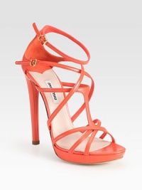 Leather t-strap with adjustable ankle straps and a slight platform. Self-covered heel, 5¼ (130mm)Covered platform, ½ (15mm)Compares to a 4¾ heel (120mm)Leather upperLeather lining and solePadded insoleMade in Italy