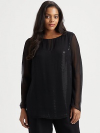 A whimsical design featuring stunning sequins and a feminine flutter hem. This pull-on style offers easy elegance. Keyhole detail at necklineSheer sleevesSequin bodiceConcealed back zipperBack princess seamsAbout 30 from shoulder to hemPolyesterDry cleanImported A whimsical design featuring stunning sequins and a feminine flutter hem. This pull-on style offers easy elegance. Keyhole detail at necklineSheer sleevesSequin bodiceConcealed back zipperBack princess seamsAbout 30 from shoulder to hemPolyesterDry cleanImported